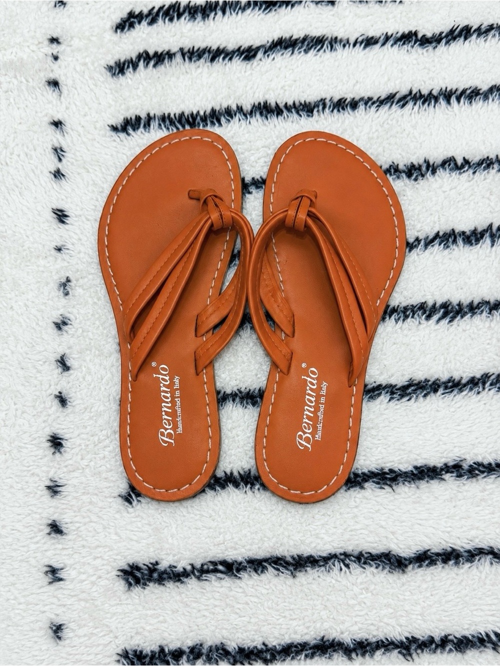 BERNARDO ORANGE LEATHER FLIP FLOPS